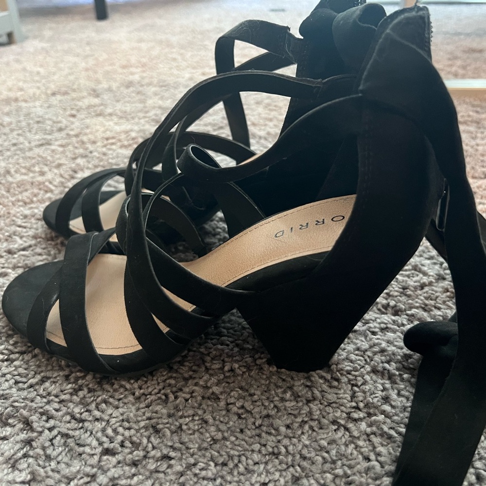 Short heals, wrap the ankle. Only worn twice. Torrid size 8 fits like a 9.